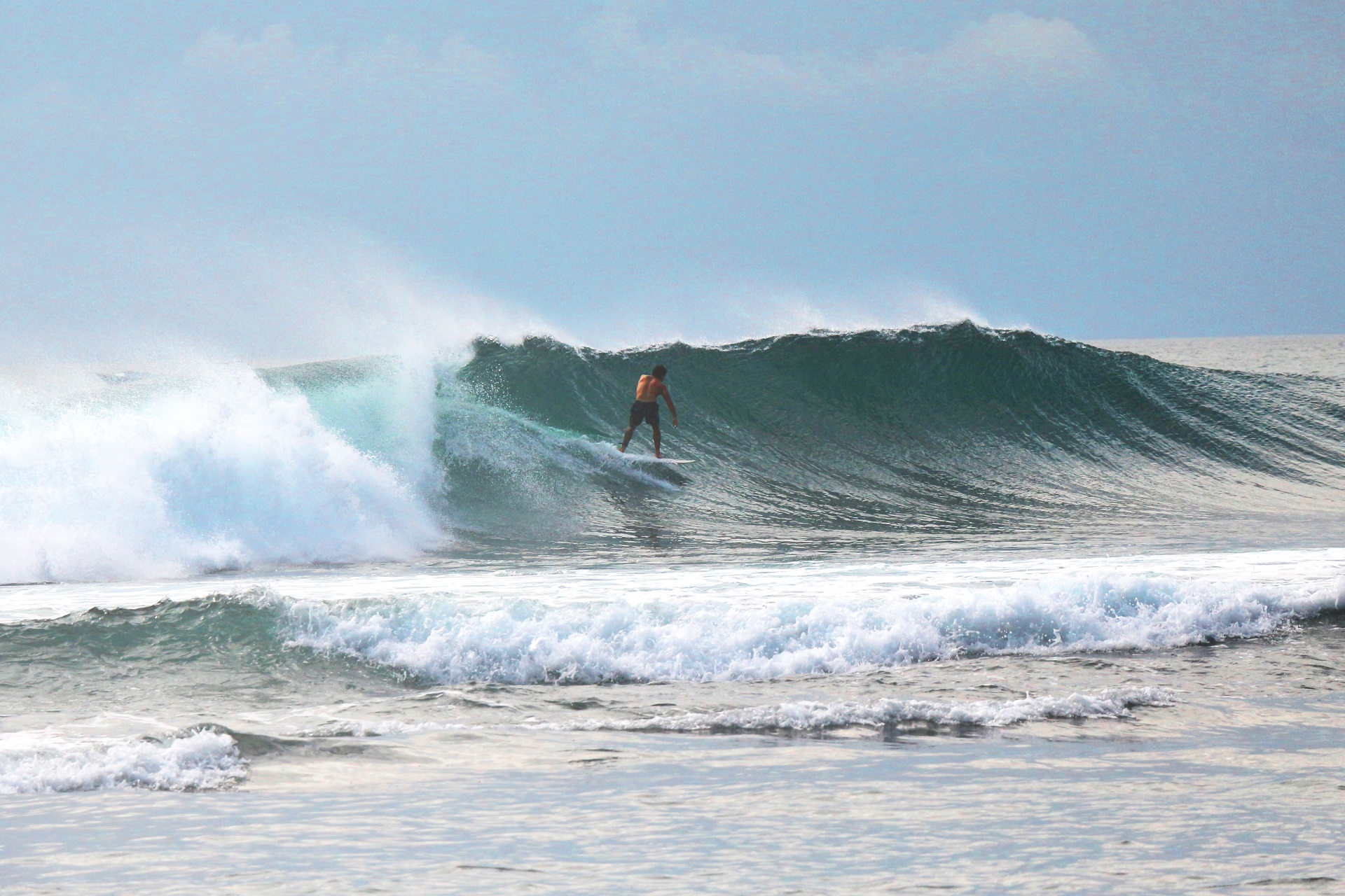 The origins of surfing: man surfing waves in Polynesia